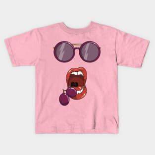 Mouth about to eat a two purple grapes while wearing matching purple sun glasses. Kids T-Shirt